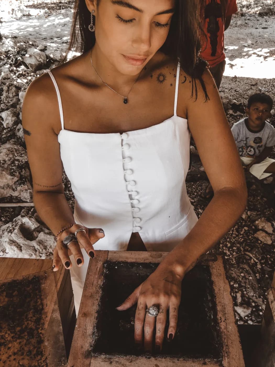 Sifting compost at the nursery